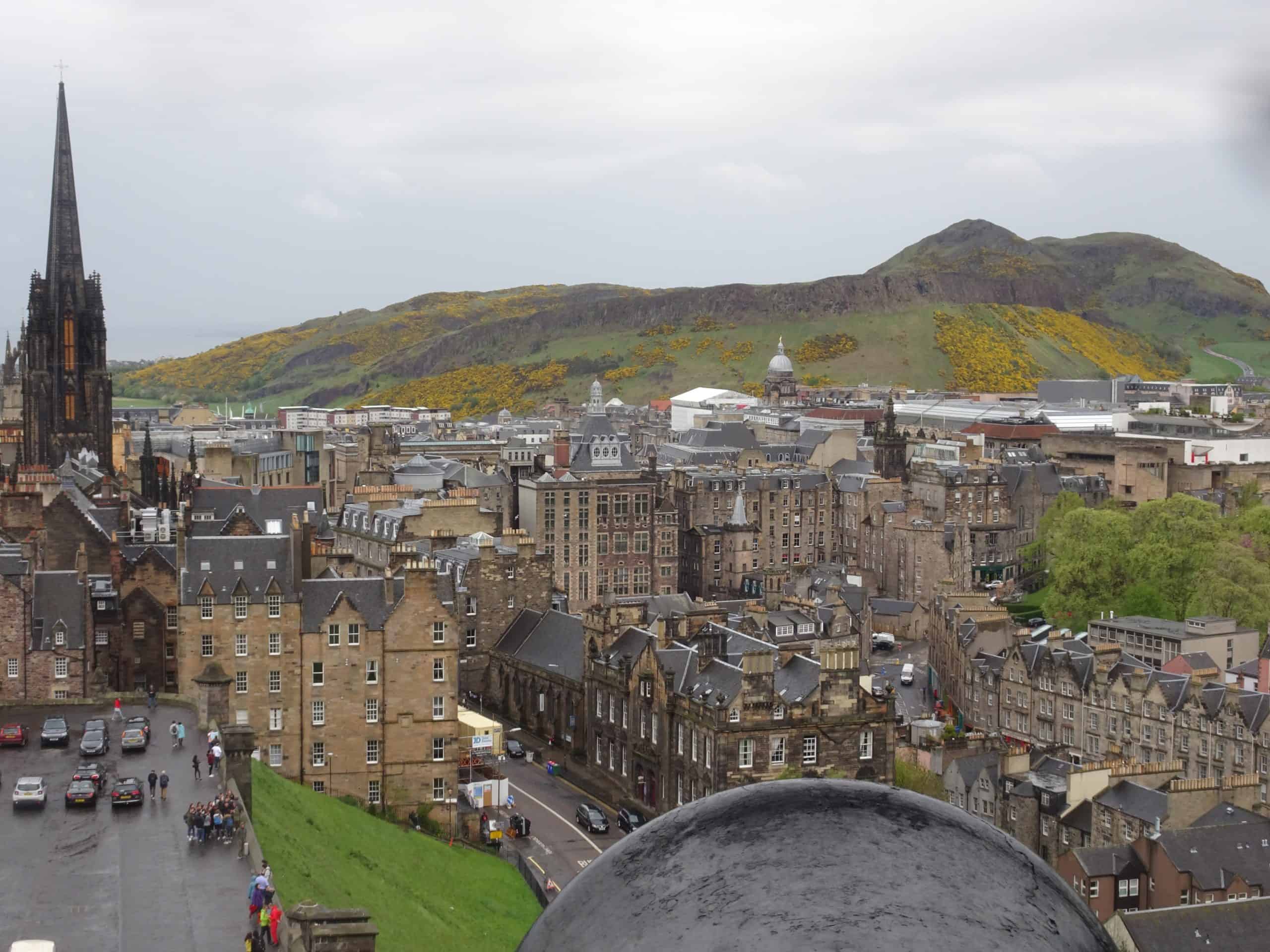 A view from one of the gun points in Edinburgh Castle of the old town, with Arthurs seat and the Scott monument in the background