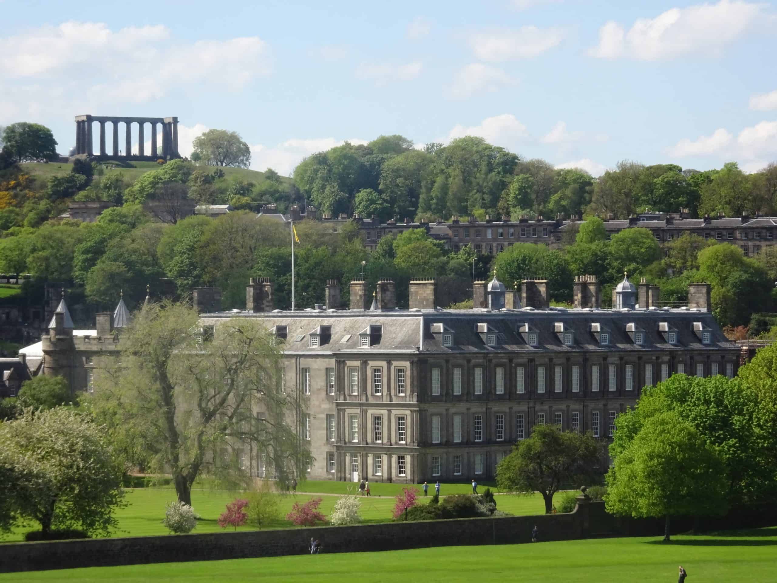 Image of Holyrood Palce and Gardens with calton hill in the background
