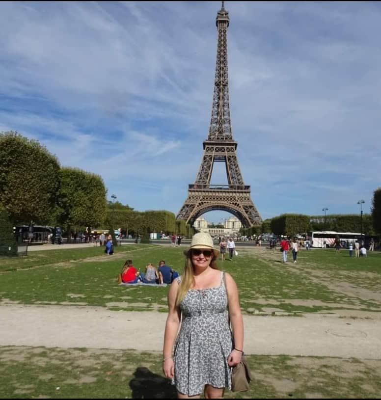 Image of me standing in front of the Eiffel tower in Paris, France 