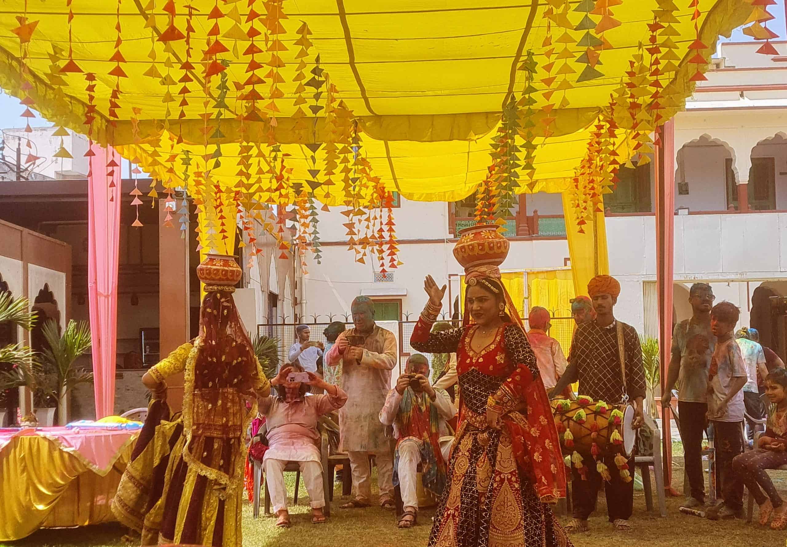 indian ladies wearing traditional dresses dancing