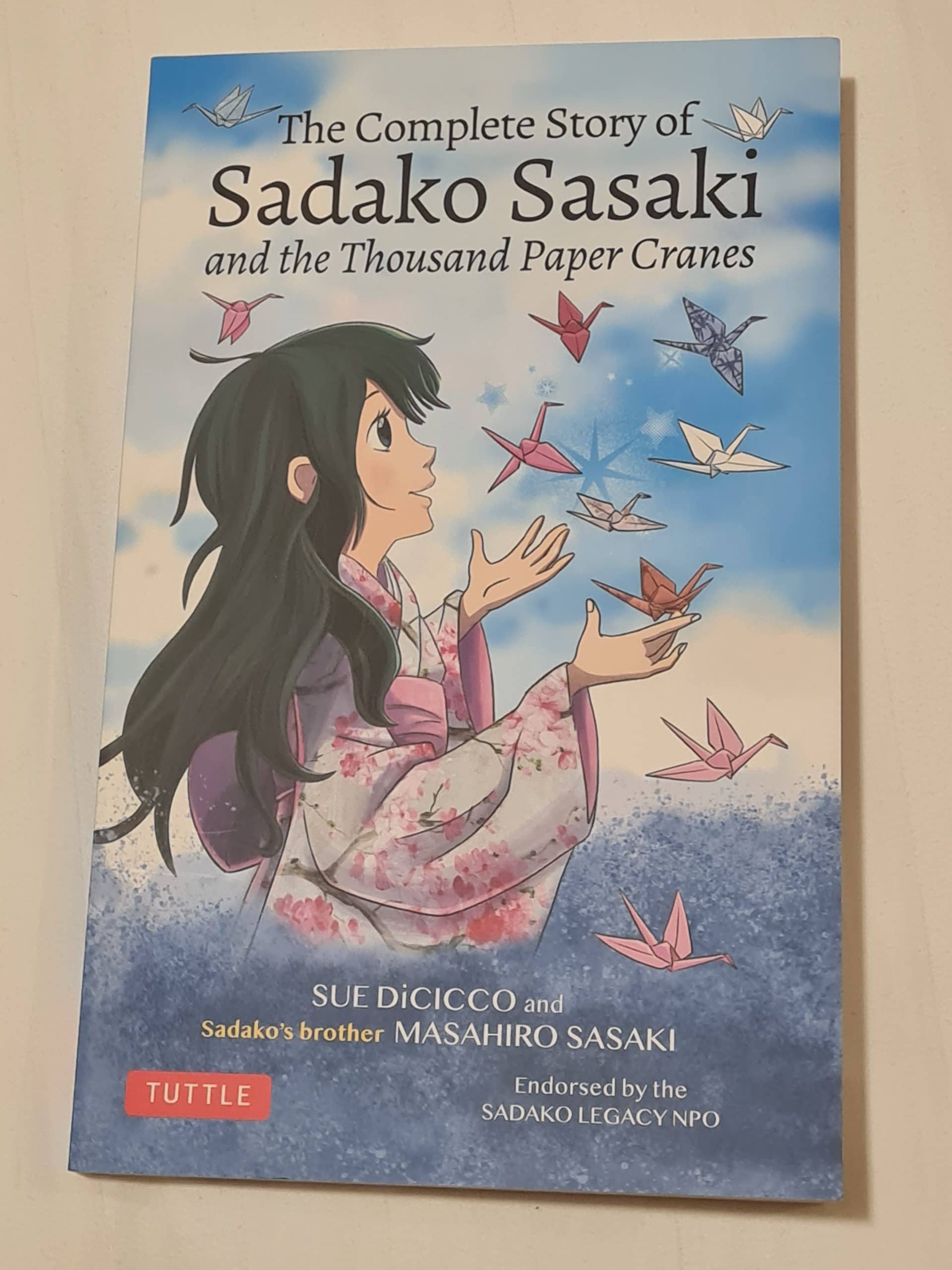 a photo of the book with the title the complete story of Sadako Sasaki and the thousand paper cranes.