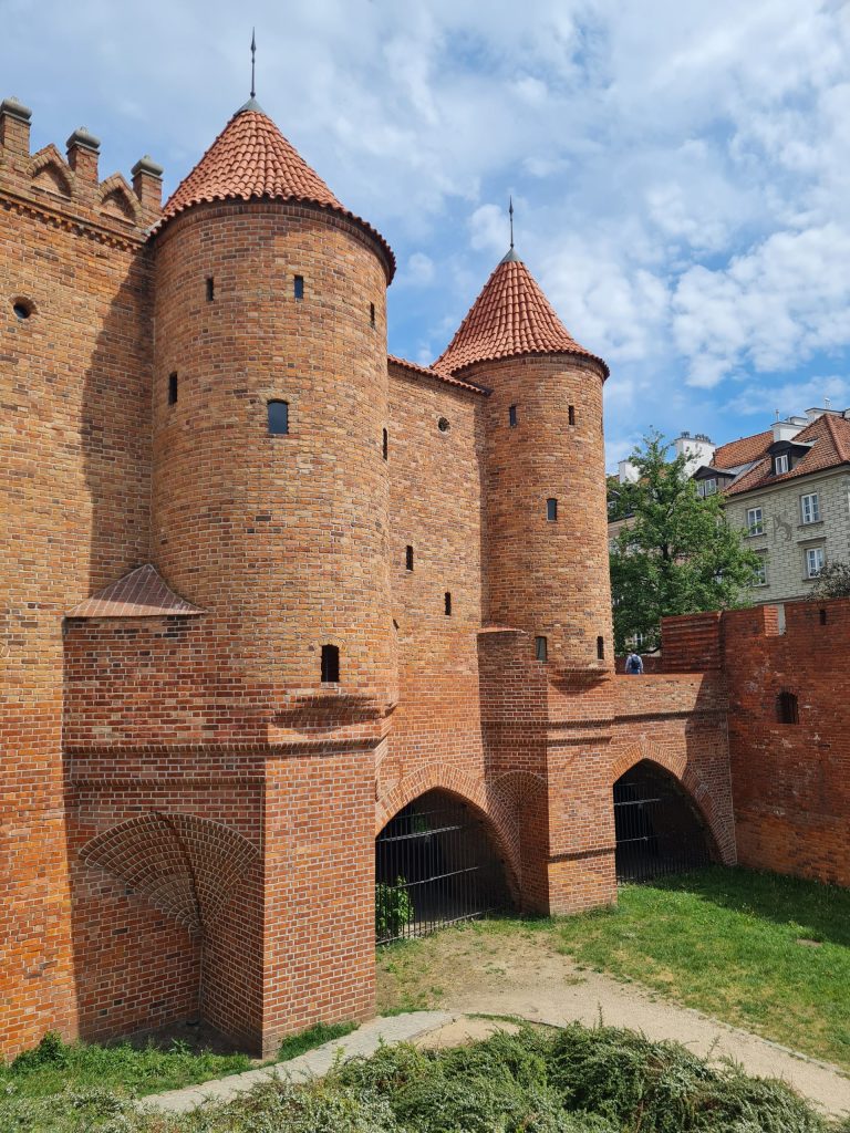 the orange coloured brick of the warsaw old town's Barbican