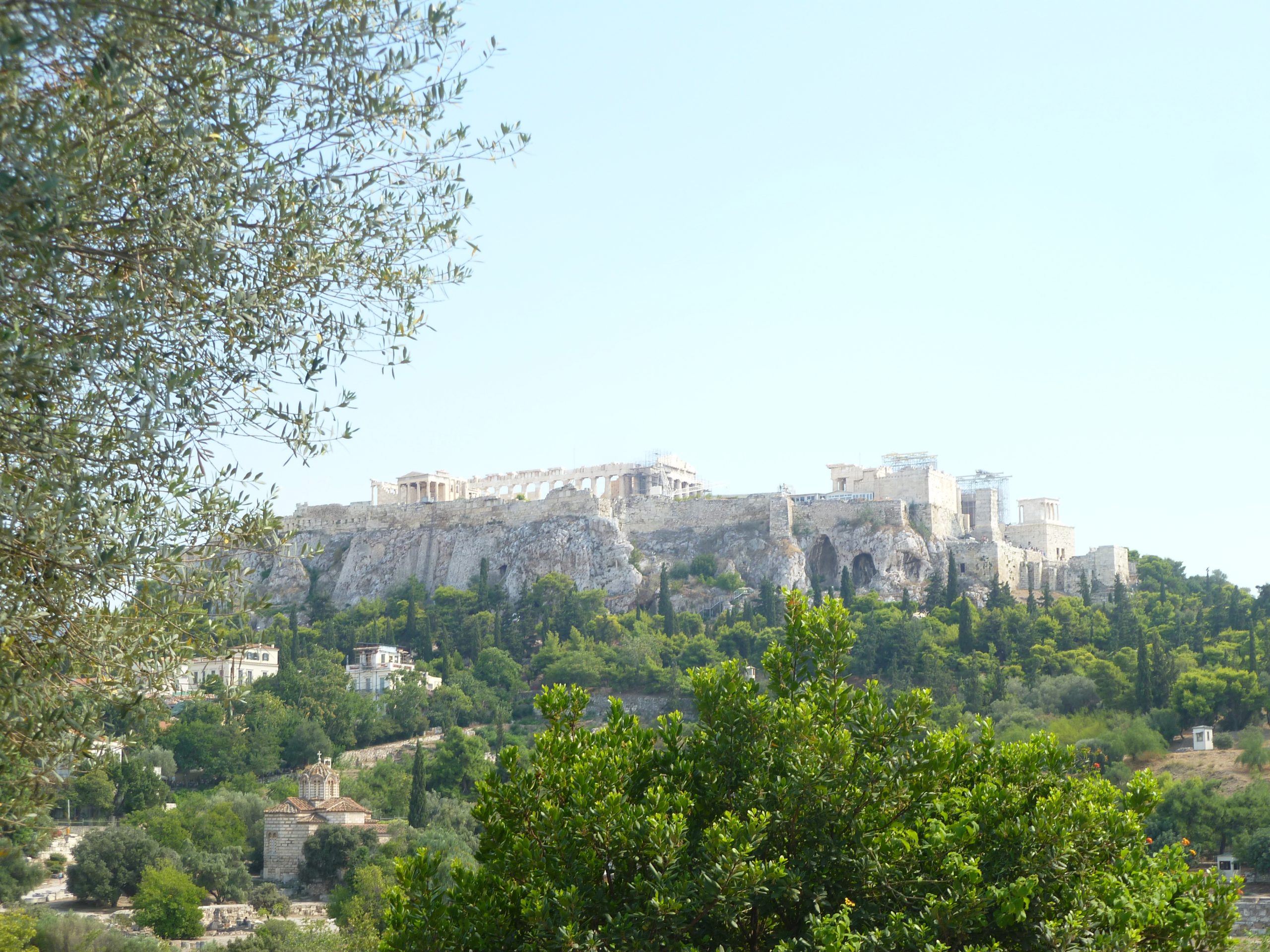 image of the rocky Acropolis, where you can see the Parthenon, with the Roman Agora in the foreground